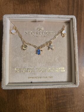 Neo Relique Gold Charm Necklace with Blue Crystal Turtle